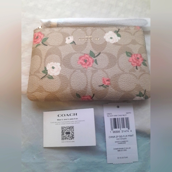 Coach Handbags - New Coach Wristlet In Signature Leather/ Canvas/Floral Print